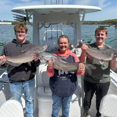 a person holding a fish in the water