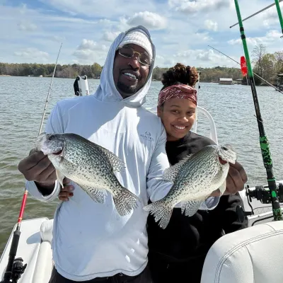 a man and a woman holding a fish
