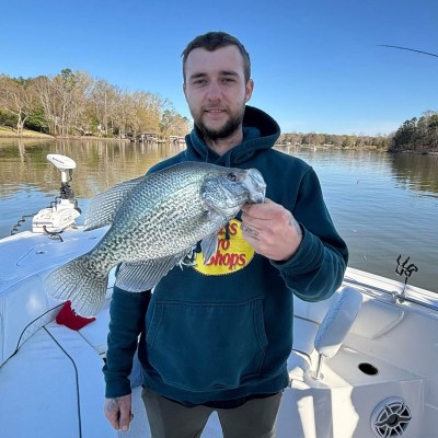 a person holding a fish in the water
