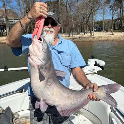 a man holding a fish