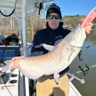 a person holding a fish